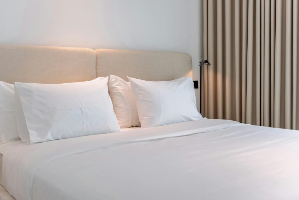 Inviting modern bedroom with beige accents, perfect for a cozy vacation rental stay.